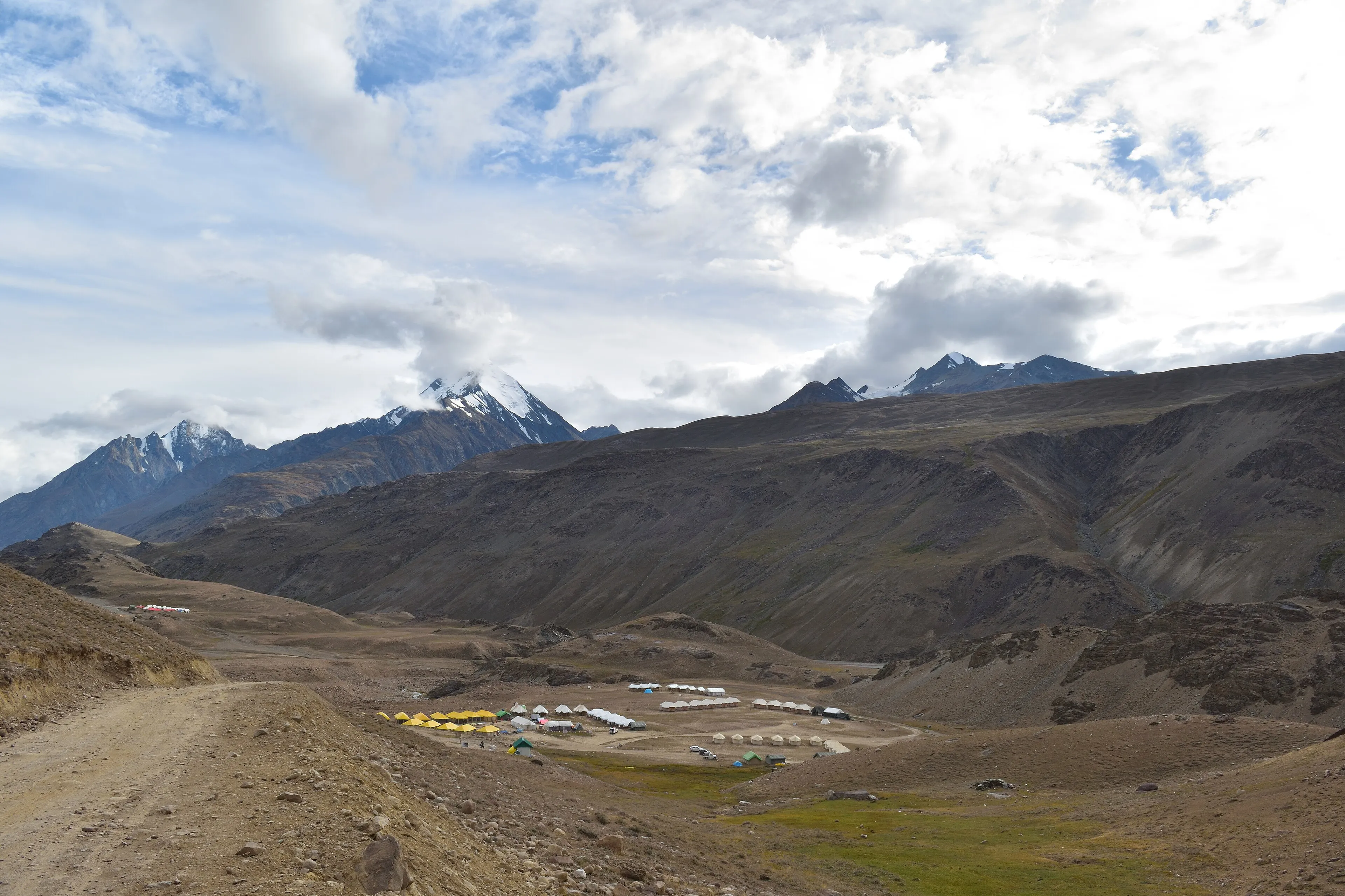 High-altitude road switchbacks climbing toward a Himalayan pass in Spiti